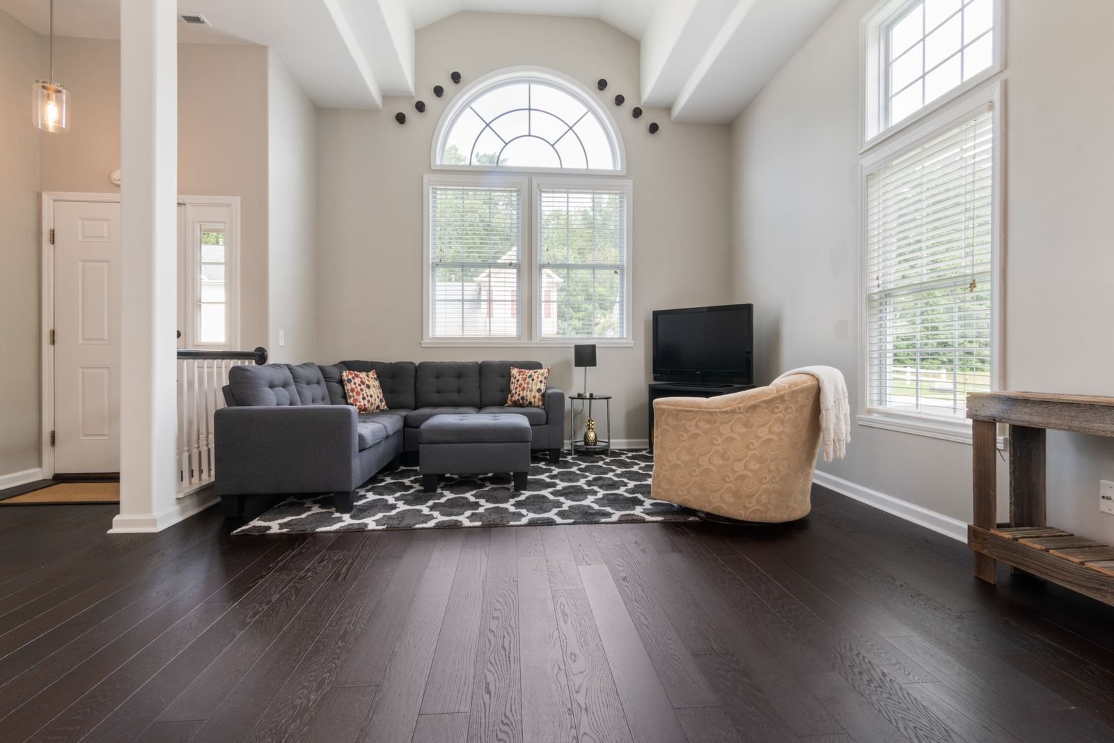 Bright modern living room with high ceilings and large windows