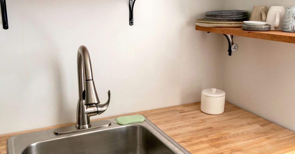 Kitchen sink and faucet in a compact modern kitchen